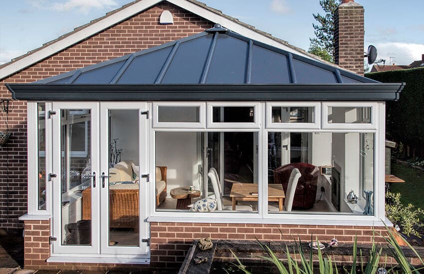 black Livinroof on a white Upvc conservatory
