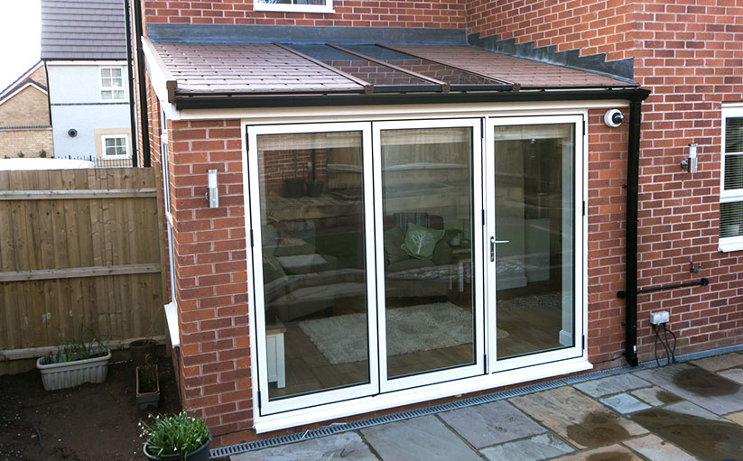 ultraroof-380 lean to red brick conservatory aliminuminem bi-fold
