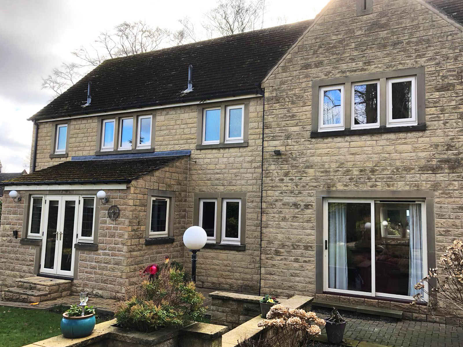 White uPVC casement windows and french door on a country house.