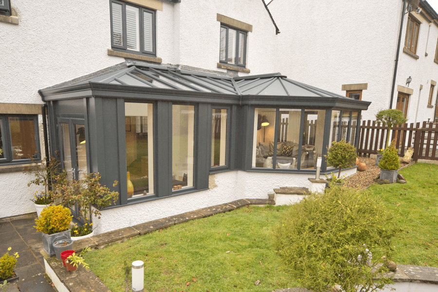 p-shaped conservatory grey with a windowed roof