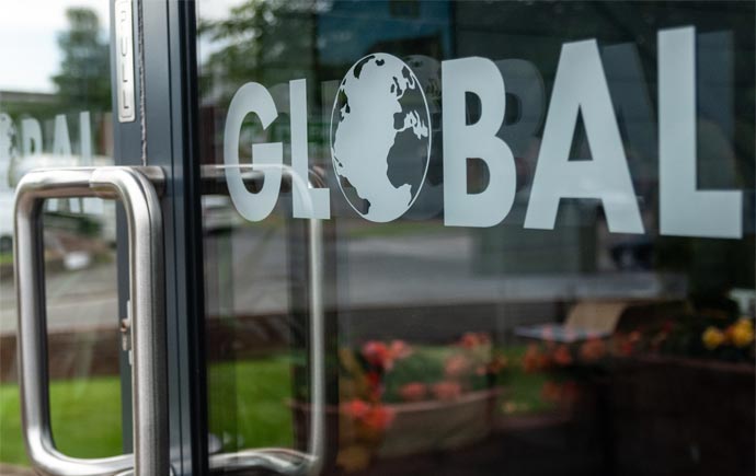 aesthetic photo of the Global Windows logo printed on the entrance doors to the Global Windows showroom - Global Windows